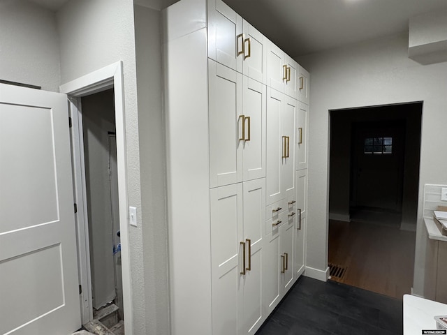 hall featuring dark wood-style flooring