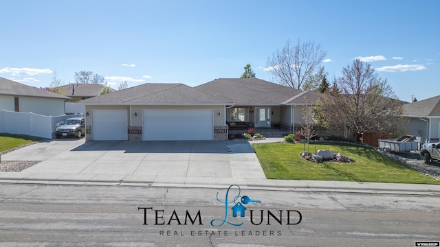 ranch-style home featuring an attached garage, a front yard, driveway, brick siding, and a shingled roof