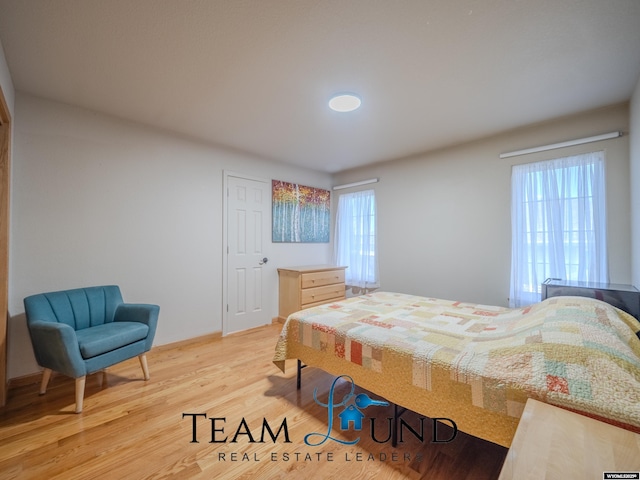 bedroom with light wood-type flooring