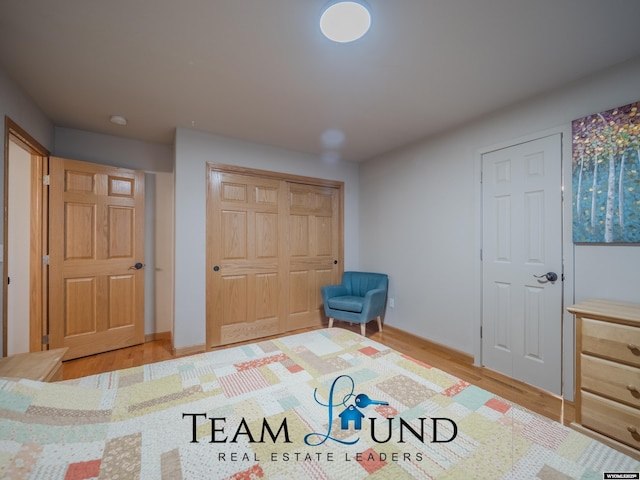 unfurnished room with wood finished floors and baseboards