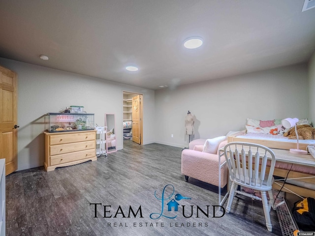 bedroom featuring wood finished floors, baseboards, and recessed lighting