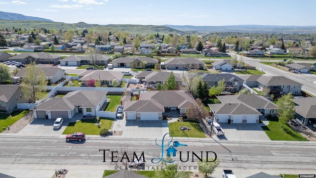 aerial view of residential area featuring a mountain backdrop