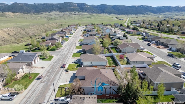 aerial perspective of suburban area featuring a mountainous background