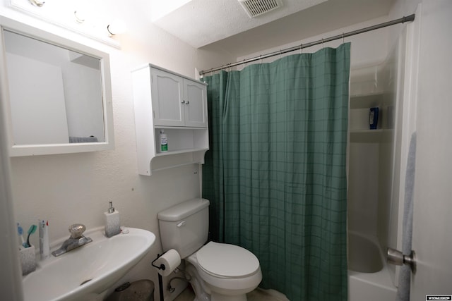 108 Cherokee Ct, Evanston, WY 82930 - bathroom with a sink, toilet, and shower / bath combo with shower curtain