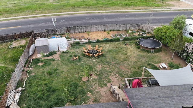 108 Cherokee Ct, Evanston, WY 82930 - view of yard featuring a trampoline and a fire pit