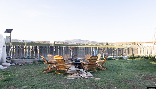 108 Cherokee Ct, Evanston, WY 82930 - view of yard featuring a fire pit and a mountain view