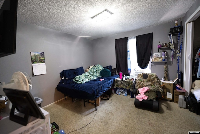 108 Cherokee Ct, Evanston, WY 82930 - carpeted bedroom featuring a textured ceiling