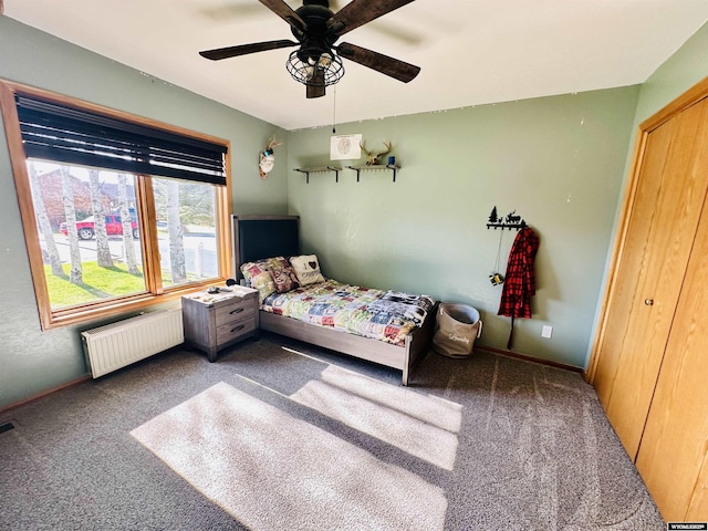 920 Laramie St, Rock Springs, WY 82901 - carpeted bedroom featuring radiator heating unit, a ceiling fan, and baseboards