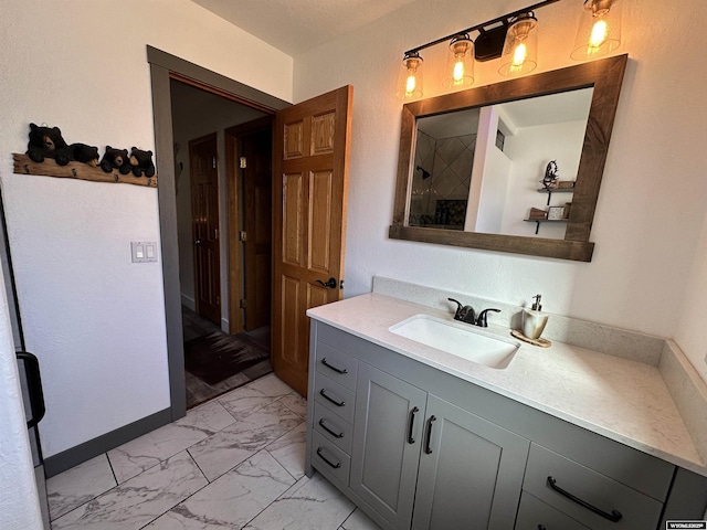 920 Laramie St, Rock Springs, WY 82901 - full bathroom with marble look tile flooring, a shower, and vanity