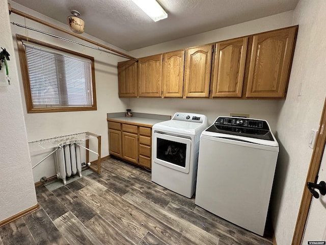 920 Laramie St, Rock Springs, WY 82901 - clothes washing area with cabinet space, washer and dryer, dark wood-style flooring, and baseboards