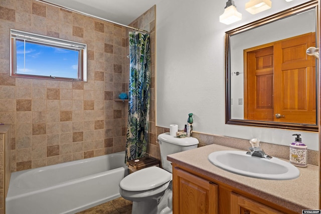 bathroom featuring shower / tub combo with curtain, vanity, toilet, and tile patterned floors