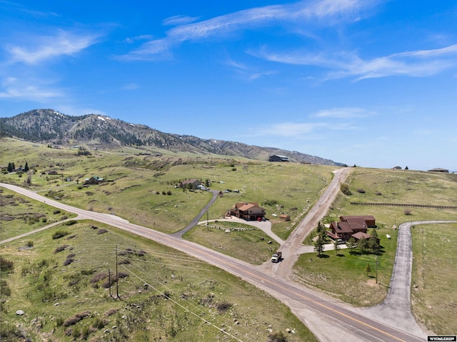 aerial view of property's location featuring rural landscape and a mountainous background