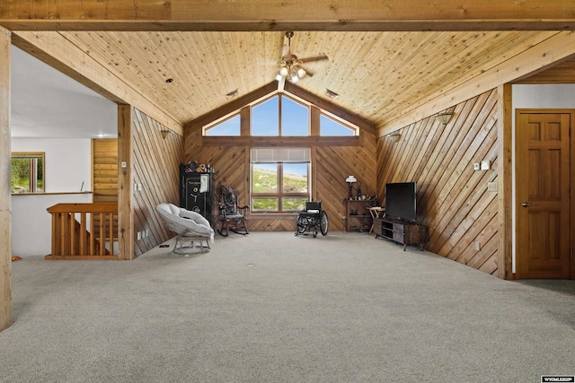 sitting room with carpet, wood walls, and wood ceiling