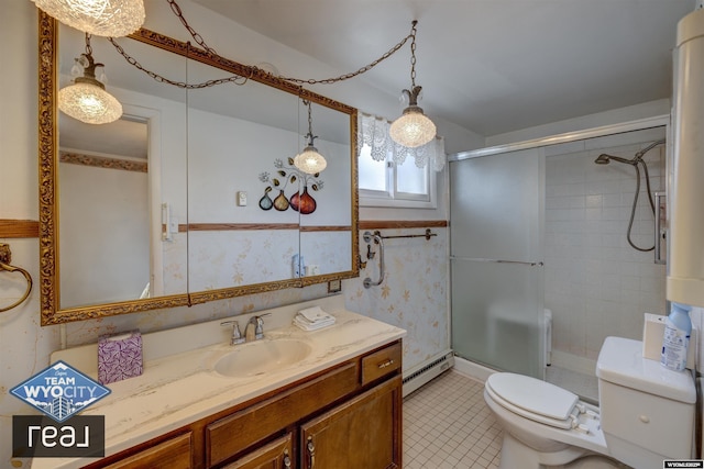 bathroom with a baseboard radiator, toilet, a stall shower, vanity, and tile patterned floors