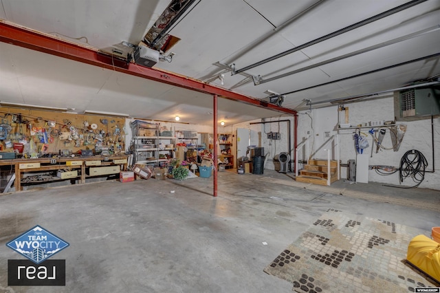 garage with a garage door opener and a workshop area