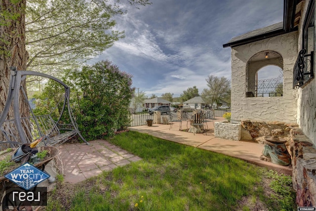 fenced backyard featuring a patio