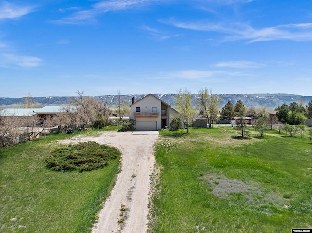 view of front of property featuring driveway and a garage