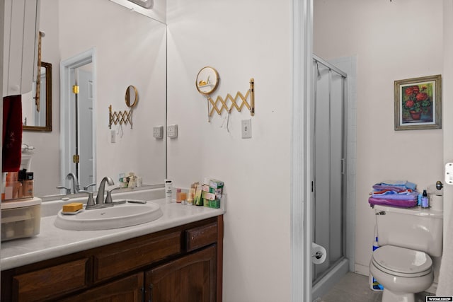 full bathroom with a stall shower, tile patterned flooring, vanity, and toilet