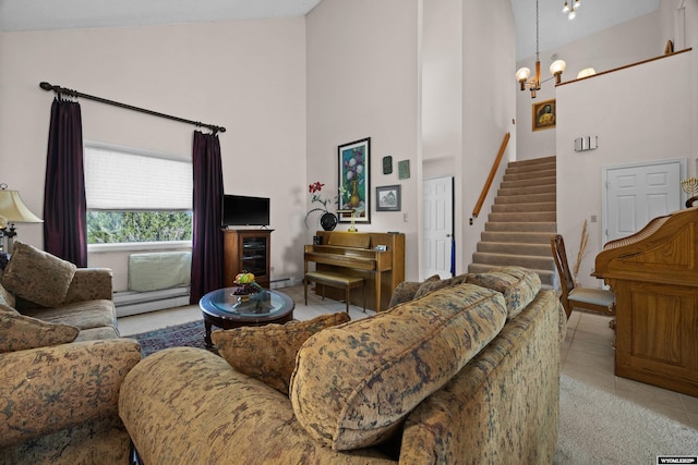 tiled living room with high vaulted ceiling, baseboard heating, stairway, and a chandelier