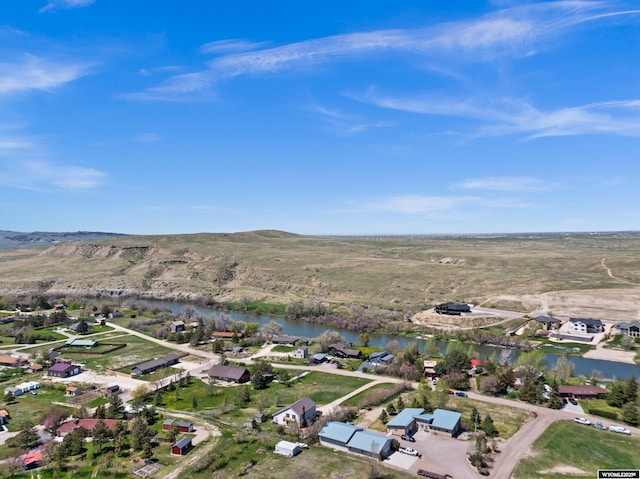 aerial view of property's location featuring a large body of water