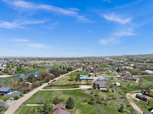 aerial view of residential area featuring a large body of water