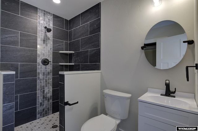 bathroom with walk in shower, vanity, toilet, and recessed lighting
