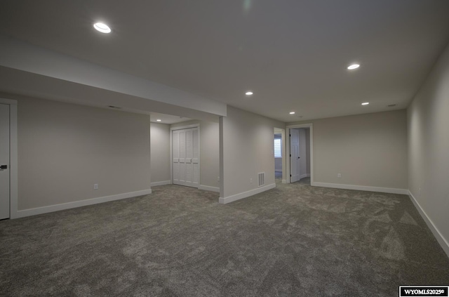 below grade area with carpet, recessed lighting, and baseboards
