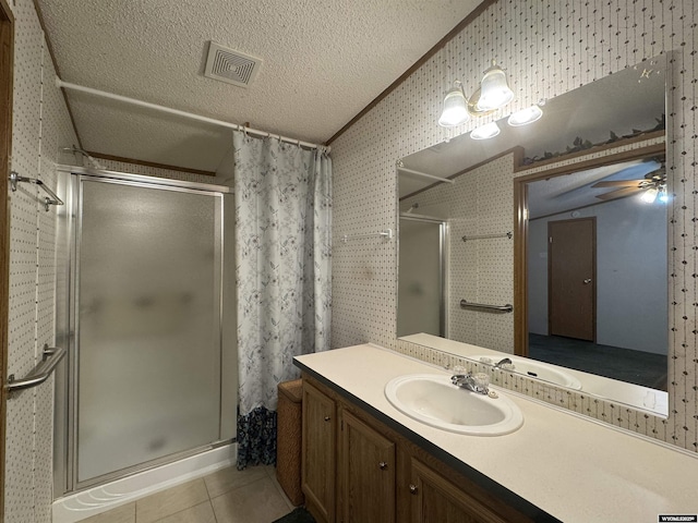 1414 Eileen St, Riverton, WY 82501 - bathroom with a shower stall, tile patterned floors, ceiling fan, vanity, and vaulted ceiling