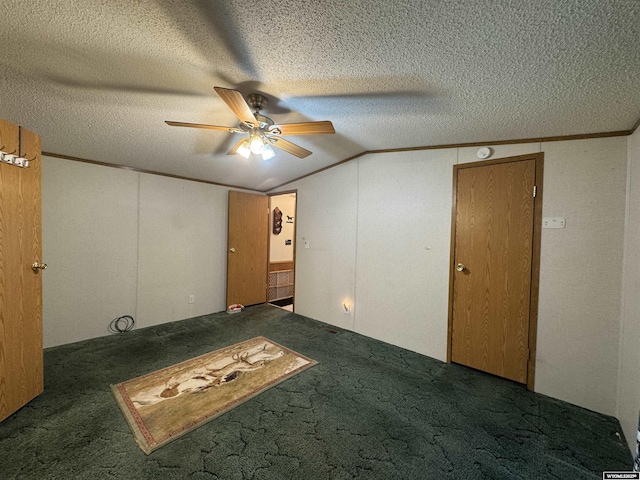 1414 Eileen St, Riverton, WY 82501 - empty room featuring carpet flooring, ceiling fan, vaulted ceiling, and a textured ceiling