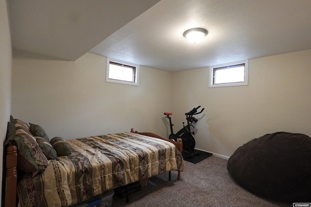 bedroom featuring carpet floors and baseboards