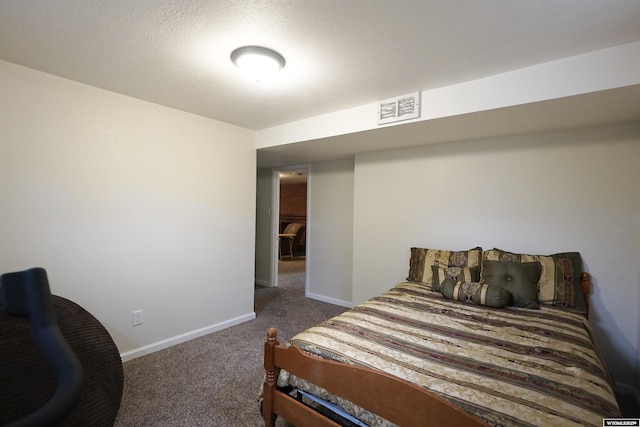bedroom featuring carpet and baseboards