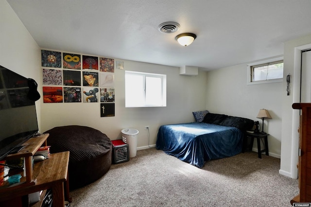 carpeted bedroom featuring baseboards