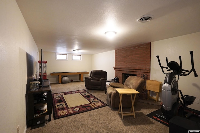 living room with carpet, a brick fireplace, and billiards table