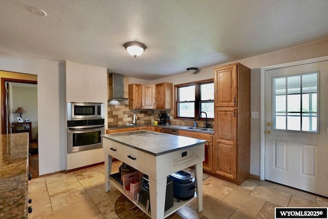 kitchen with open shelves, stainless steel appliances, a sink, wall chimney exhaust hood, and tasteful backsplash