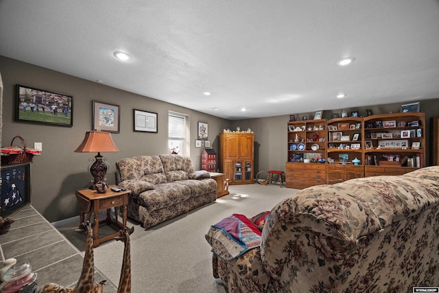carpeted living room with recessed lighting and baseboards