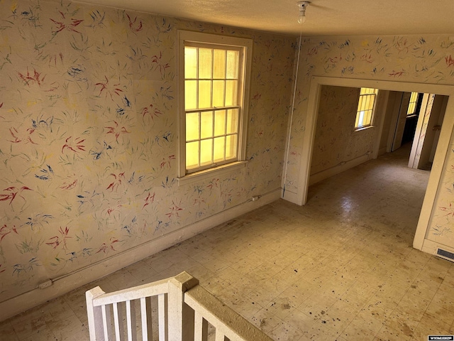 219 W Franklin St, Morrill, NE 69358 - spare room featuring light flooring and wallpapered walls
