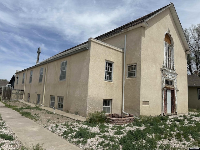 219 W Franklin St, Morrill, NE 69358 - view of property exterior with stucco siding and fence