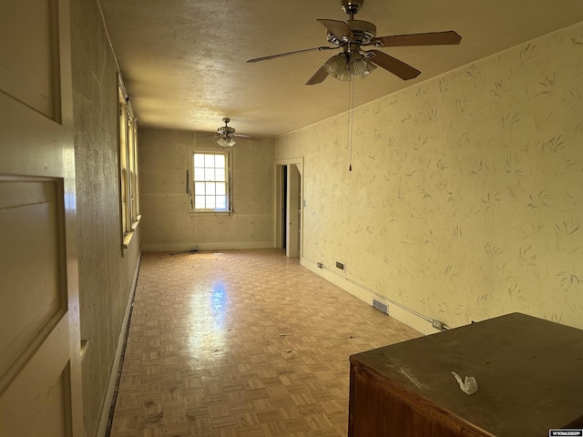219 W Franklin St, Morrill, NE 69358 - unfurnished room featuring ceiling fan, a textured ceiling, and baseboards