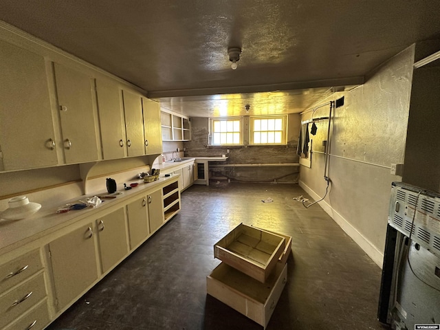 219 W Franklin St, Morrill, NE 69358 - kitchen featuring open shelves, light countertops, and heating unit