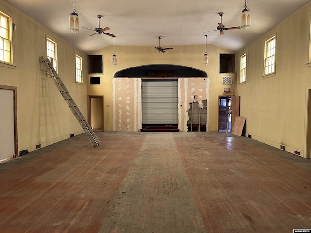 219 W Franklin St, Morrill, NE 69358 - unfurnished living room featuring ceiling fan, hardwood / wood-style floors, healthy amount of natural light, and high vaulted ceiling