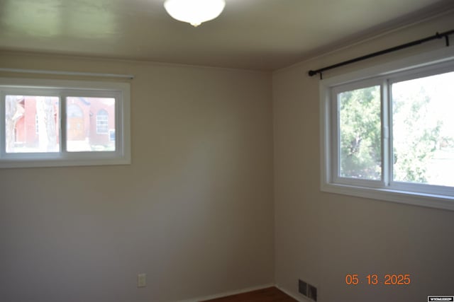 empty room featuring plenty of natural light