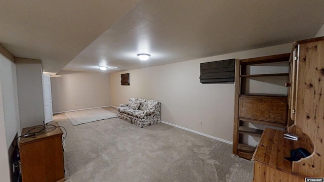 living area with carpet flooring and baseboards
