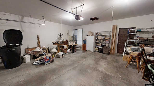 garage featuring a garage door opener