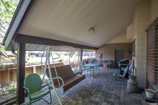 view of patio / terrace with outdoor dining area and fence