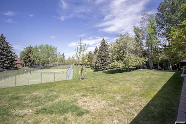 view of yard featuring a tennis court