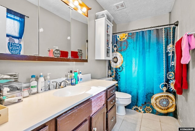 104 Canyon Hollow Dr, Evanston, WY 82930 - full bath with tile patterned floors, a textured ceiling, vanity, toilet, and a shower with curtain