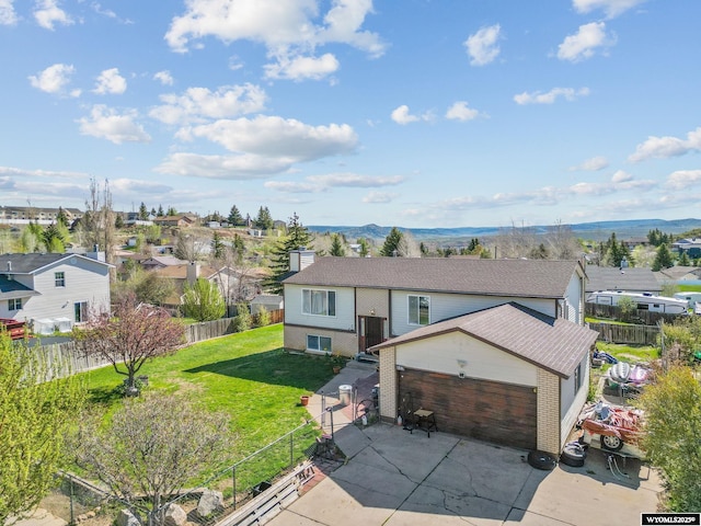 104 Canyon Hollow Dr, Evanston, WY 82930 - aerial perspective of suburban area with a mountain backdrop
