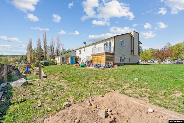 104 Canyon Hollow Dr, Evanston, WY 82930 - back of property featuring a yard and a chimney