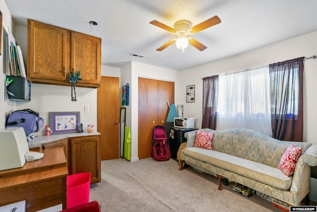 104 Canyon Hollow Dr, Evanston, WY 82930 - living area with light carpet and a ceiling fan