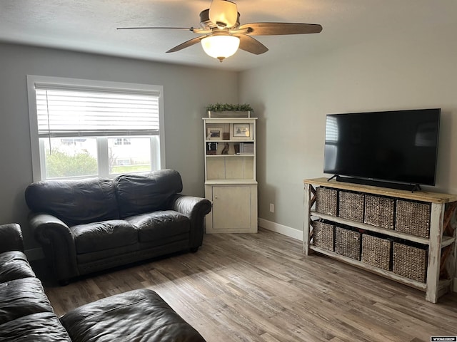 2715 Colorado Dr, Green River, WY 82935 - living area featuring a ceiling fan, wood finished floors, and baseboards